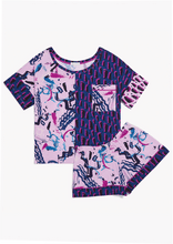 Load image into Gallery viewer, Flat lay. The Alex Pajama Set in Alivia Happy Strokes Pink features contrasting retro 80s prints. The left top panel and right shirt sleeve cuff have a lack, fuchsia, and blue leopard-style pattern. The right top panel and accent pocket have an abstract design of overlapping black, blue, and pink brush strokes on a pale pink background. The shorts have the abstract pale pink pattern with blue leg bands with fuchsia piping details at the cuff top.