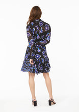 Load image into Gallery viewer, Back view. The Vicki Shirt paired with the Gabi Skirt, both in Poppy Play Black. The lined yoke and black camisole undershirt compliment the lined skirt, accentuating the sheer sections at the upper back and arms.